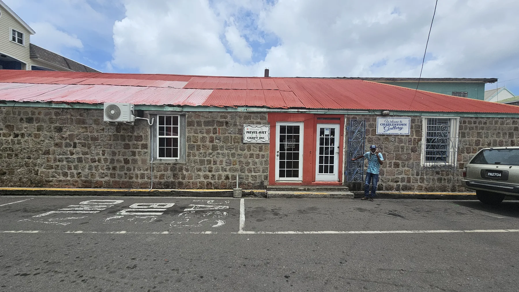 Charlestown Gallery storefront on Main St., Charlestown, Nevis, with entrance signage